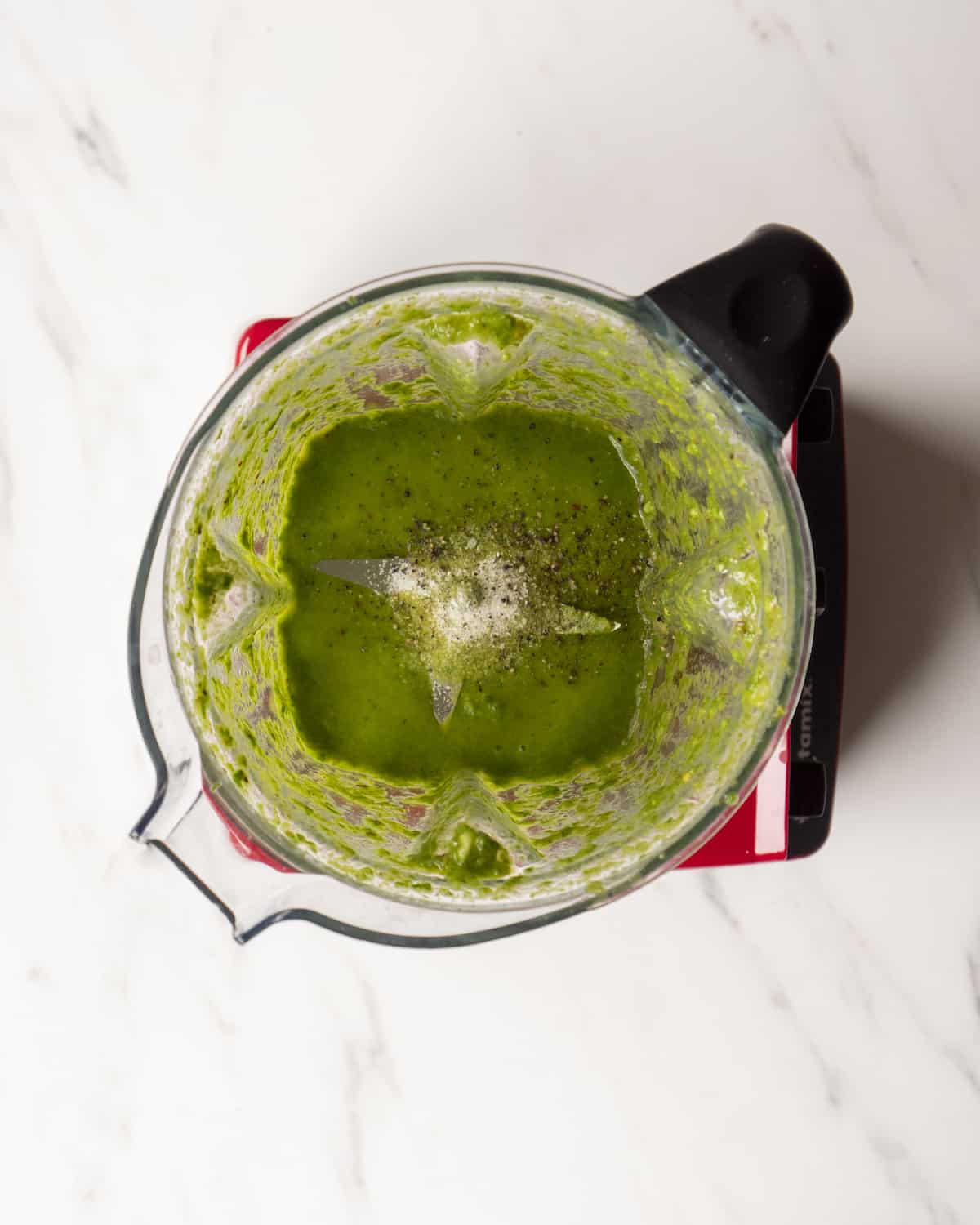 Blended basil vinaigrette in a food processor with salt and pepper.