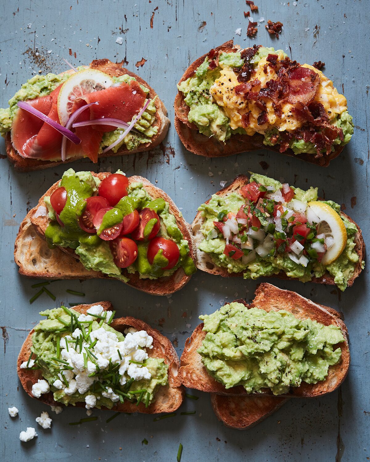 Various avocado toast recipe that includes basil tomato, pico de gallo, back and egg avocado toast